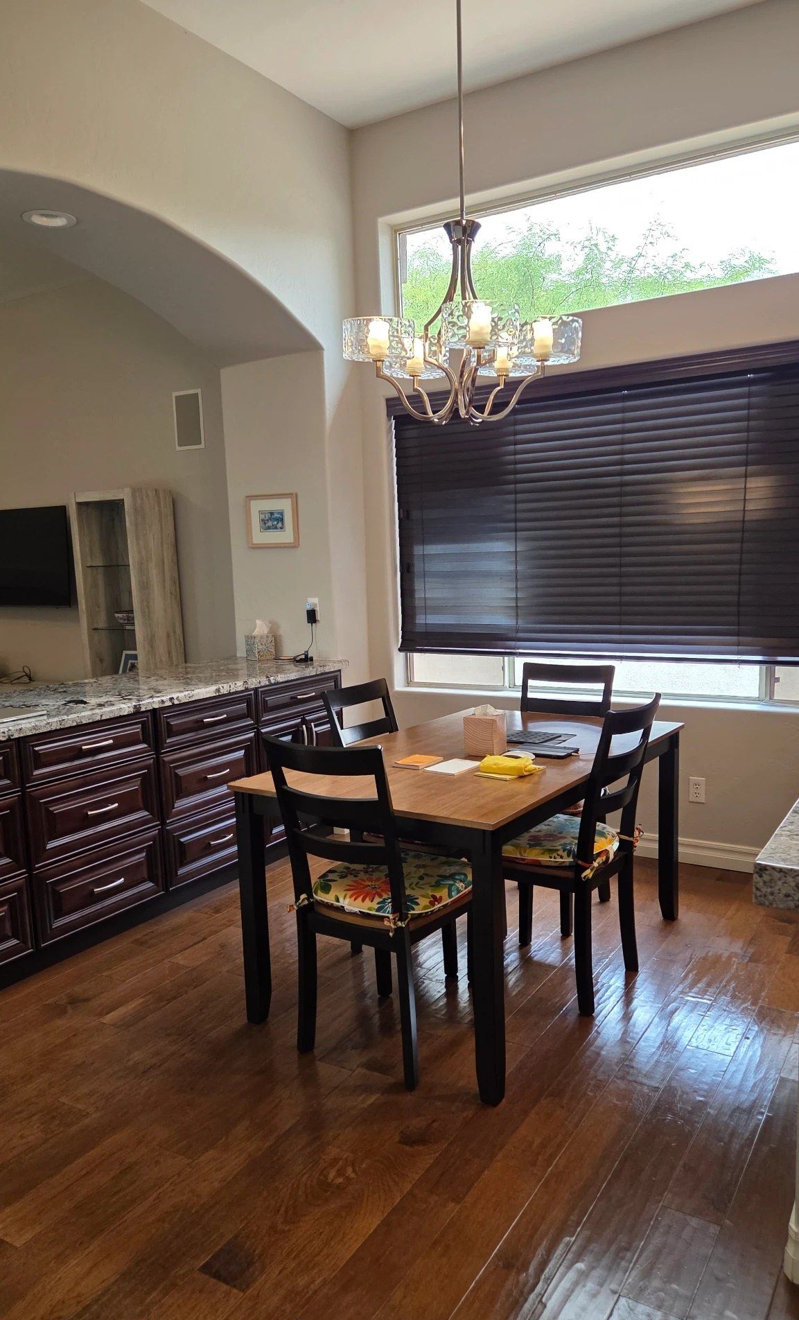 Breakfast nook with a chandelier and hardwood floors, cleaned