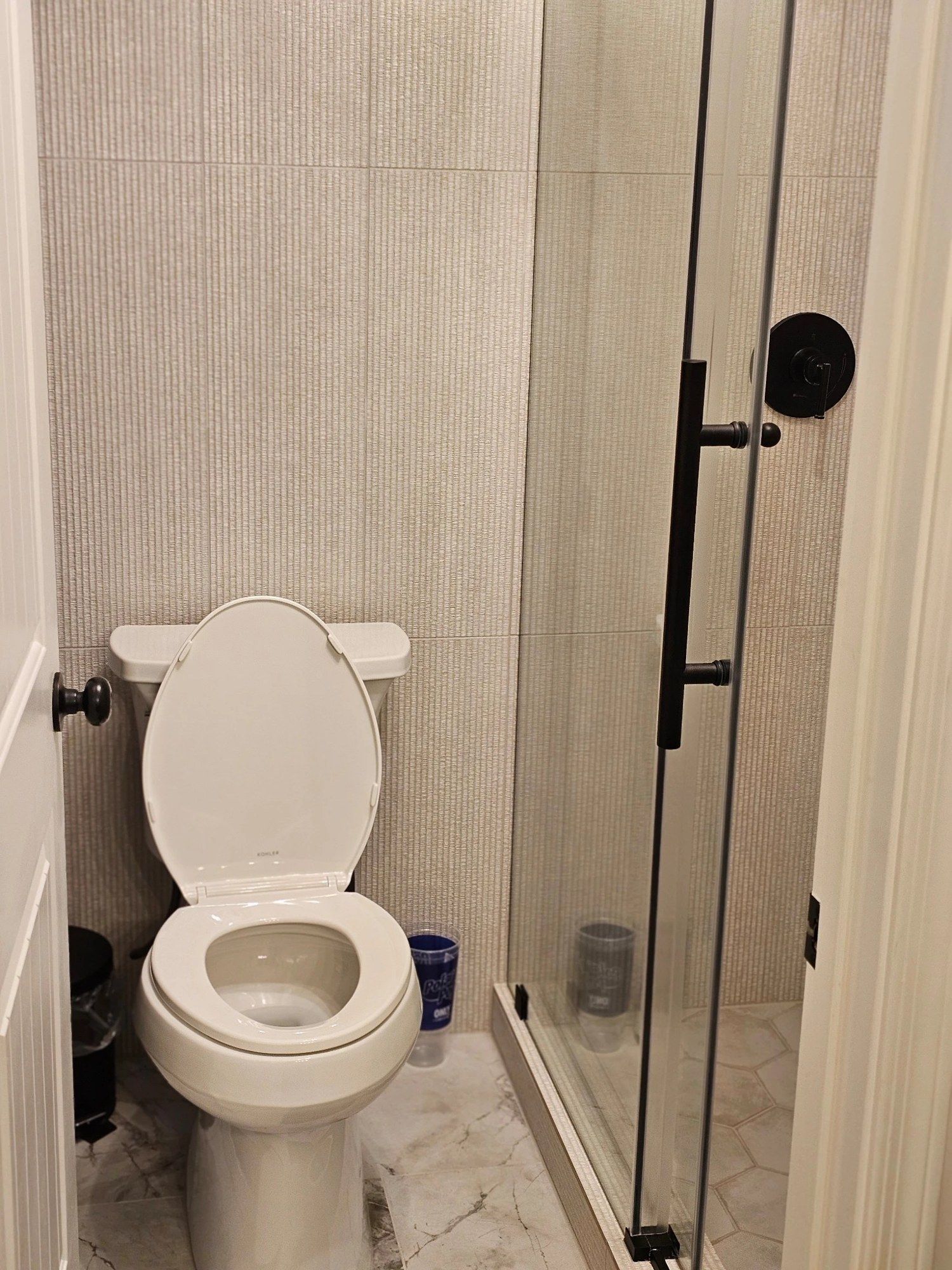 Modern bathroom with a glass shower, cleaned