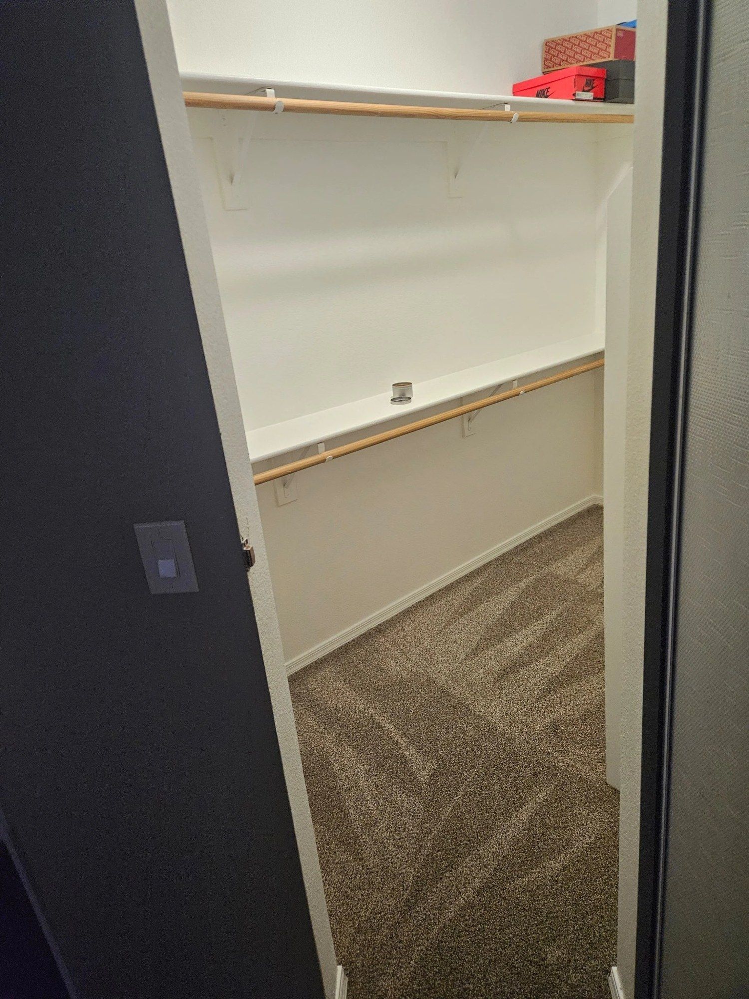 Empty walk-in closet after a move-out clean